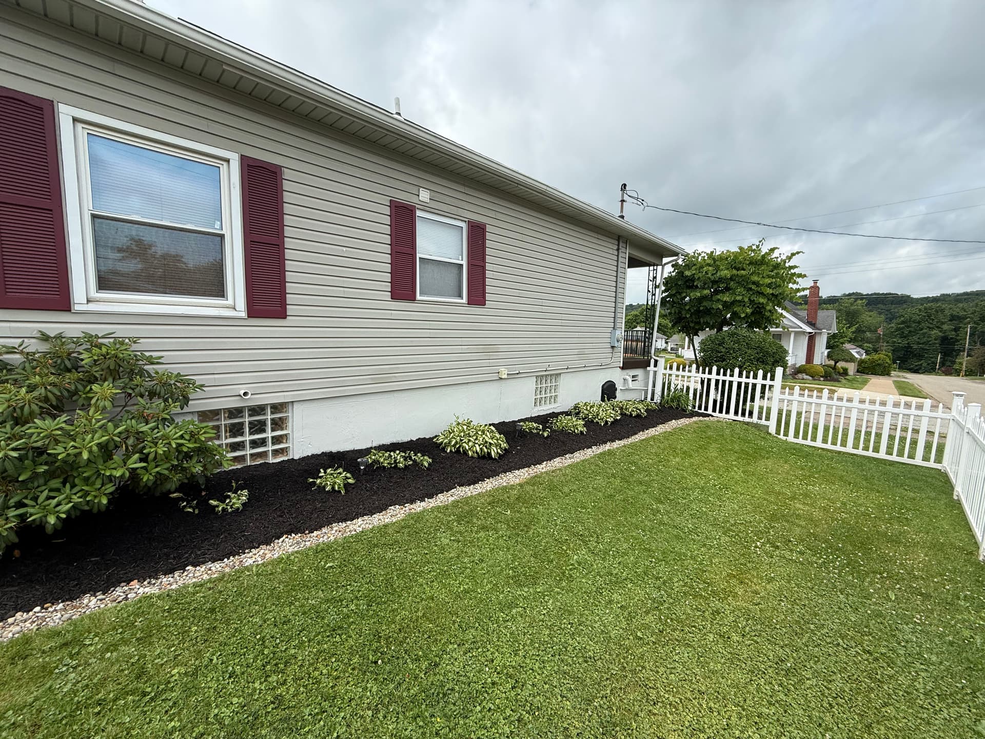 Gallery photos for Mulch and River Rock Refresh That Keeps Curb Appeal Sharp: Image #1
