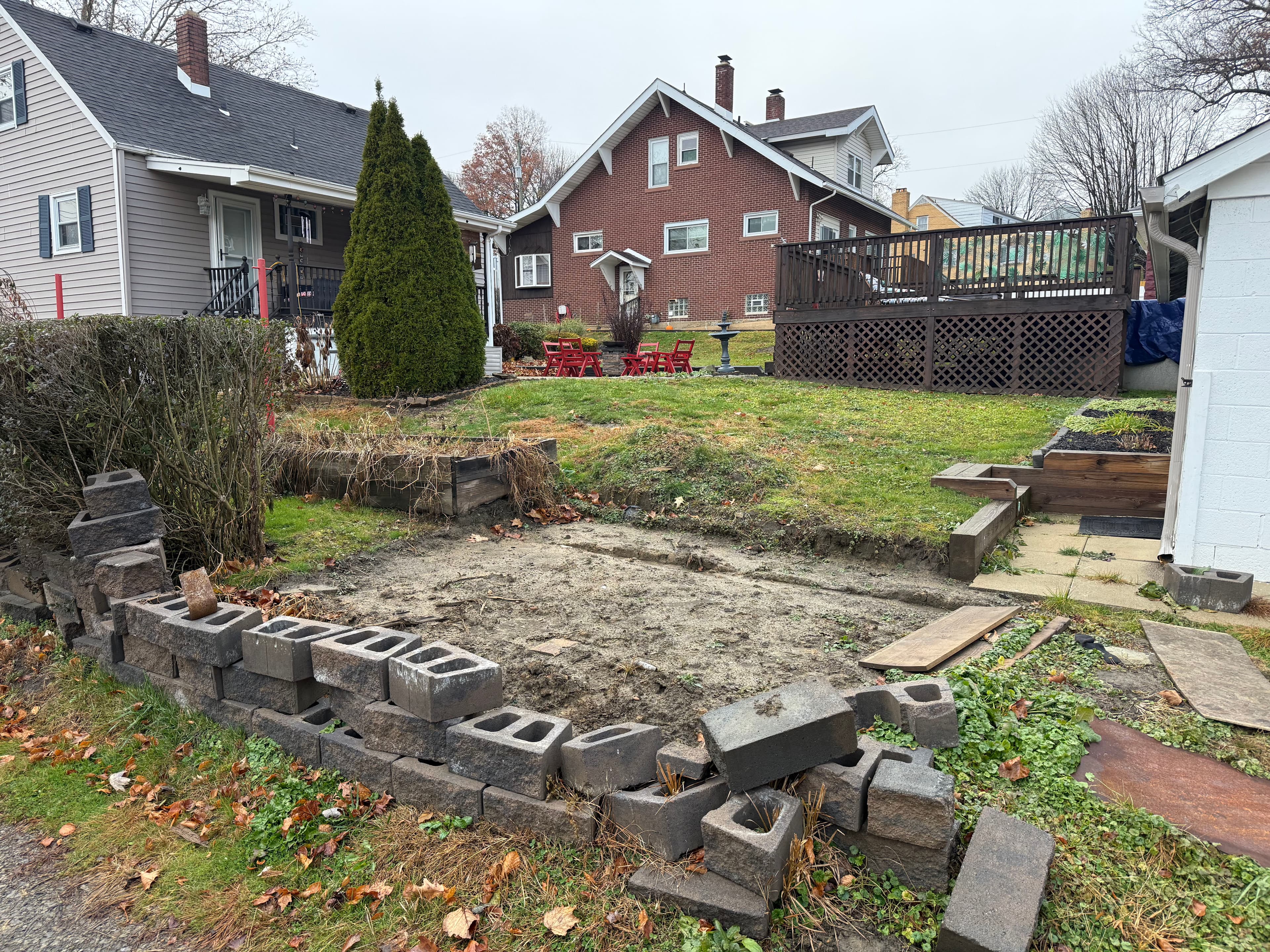 Project Backyard Makeover with Vinyl Fence and Retaining Walls image