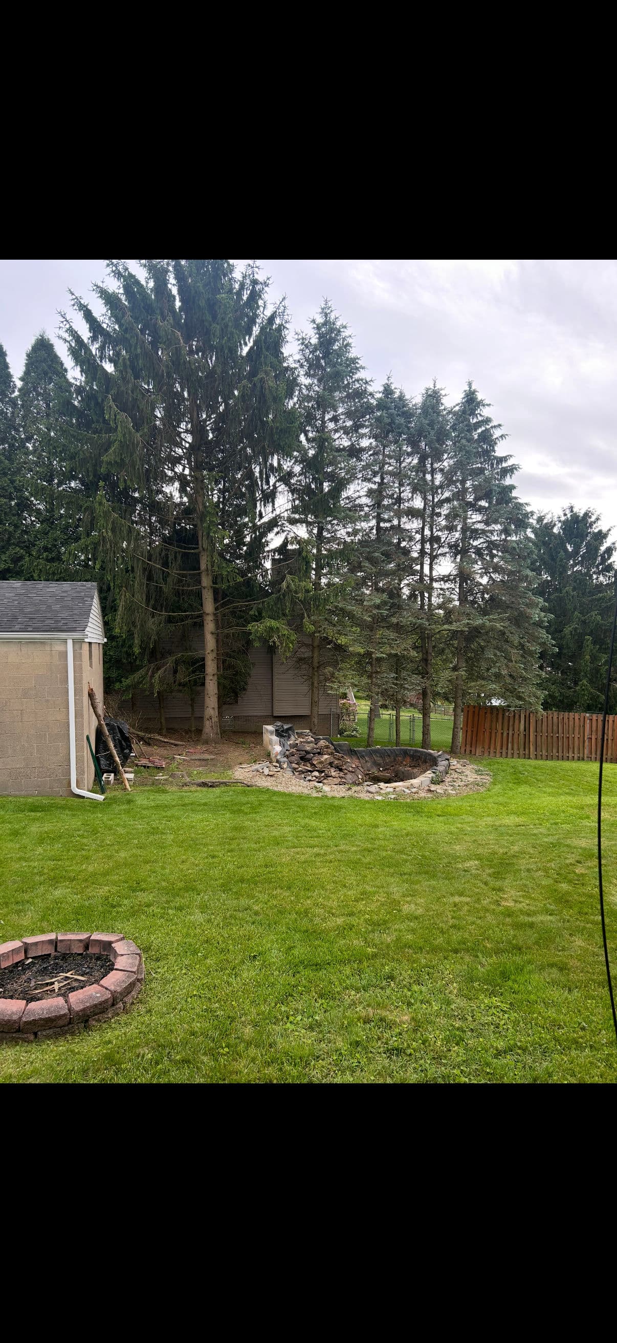 Pond Removal, Lawn Installation and Extra Parking Added to Backyard image