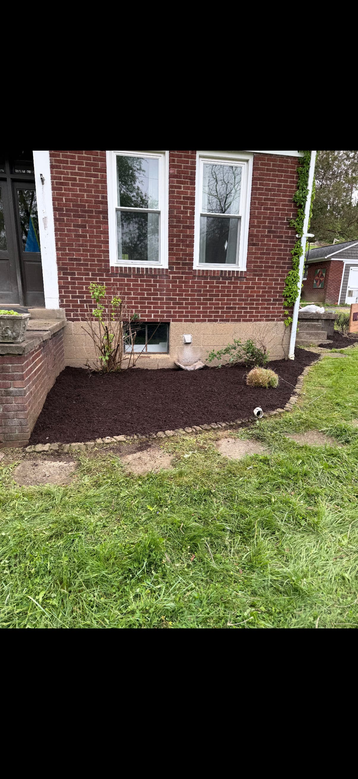 Overgrown Mulch Beds Cleaned Up and Finished with Fresh Brown Mulch image