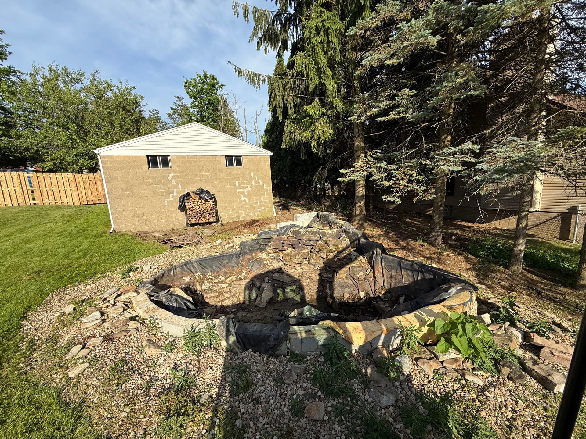 Gallery photos for Pond Removal, Lawn Installation and Extra Parking Added to Backyard: Image #1