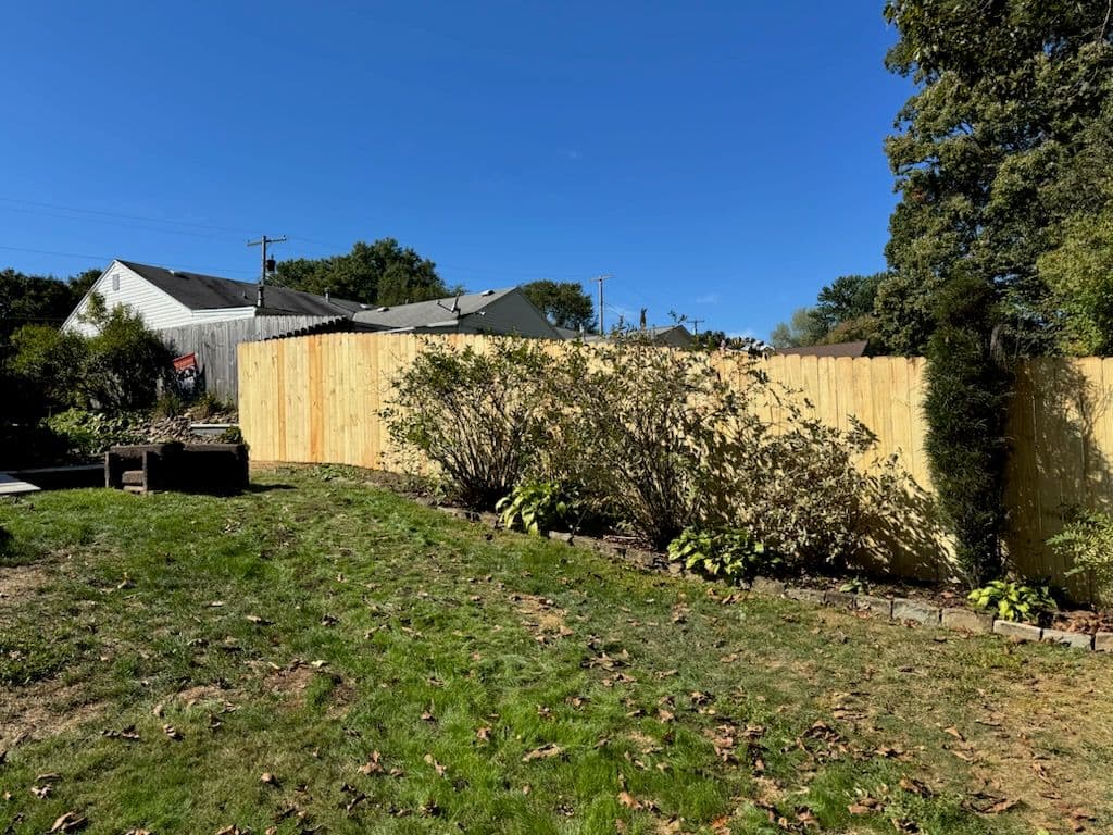 Beautiful Wood Privacy Fence and Vibrant Garden Makeover image