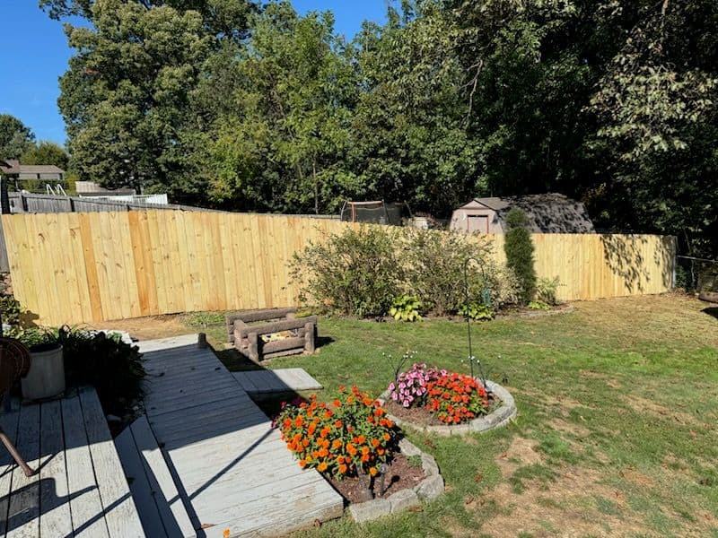 Gallery photos for Beautiful Wood Privacy Fence and Vibrant Garden Makeover: Image #1