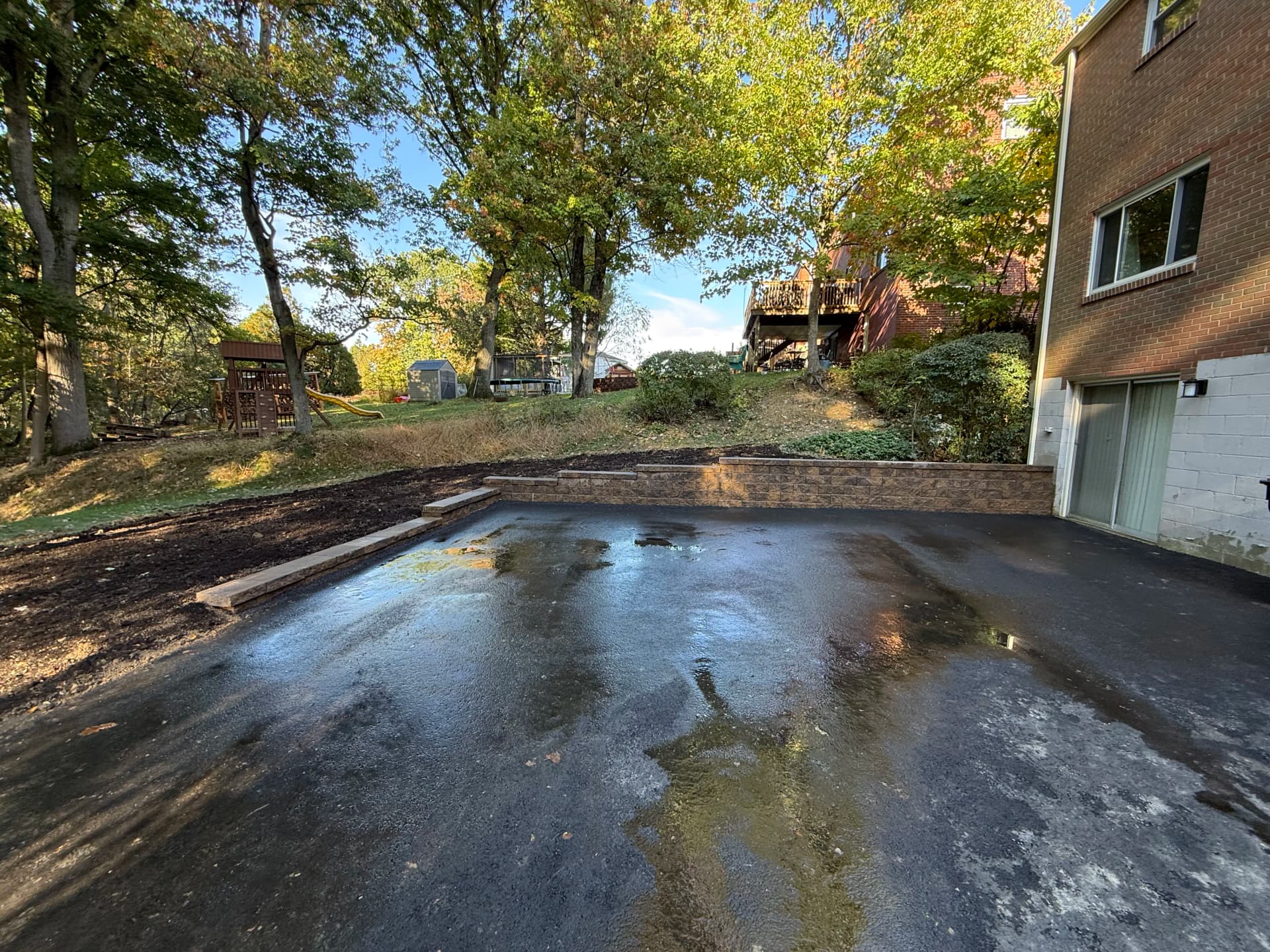 Versa-Lok Retaining Wall Built to Hold a Sloped Yard in Place image