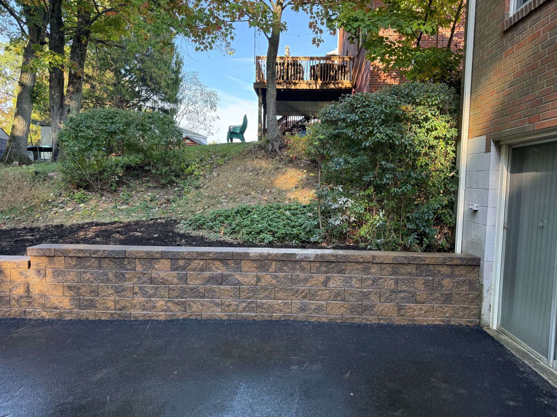 Gallery photos for Versa-Lok Retaining Wall Built to Hold a Sloped Yard in Place: Image #1